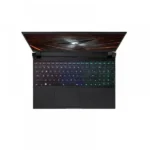Top-down view of a black gaming laptop opened, rgb backlit keyboard illuminated, screen showing abstract lines.