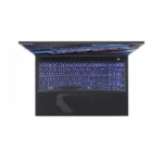 Top-down view of a black laptop open with a blue-lit keyboard and a large touchpad area visible beneath the keyboard edge.