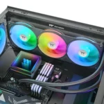 Open pc case with three rainbow rgb fans, cpu cooler, and illuminated ram in a high-end build with visible components.