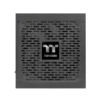 Thermaltake power supply unit with a perforated vent grille and centered logo on the front panel
