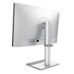 Rear view of a silver computer monitor mounted on a tall, adjustable stand with ports visible on the back.
