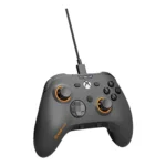 Wired xbox-style game controller in dark gray with orange accents and a braided usb cable coming from the top center