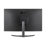Rear view of a black lg monitor on a curved stand, showing usb ports and connections on the right side panel