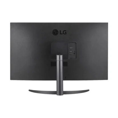 Rear view of a black lg monitor on a curved stand, showing usb ports and connections on the right side panel