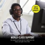 Professional support agent wearing a headset at a computer with a yellow 'limited lifetime warranty' badge nearby.