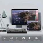 Desk setup with a monitor and laptop showing canyon wallpaper; bottom icons indicate cross‑device compatibility (pc, laptop, tablet, switch, xbox, playstation).