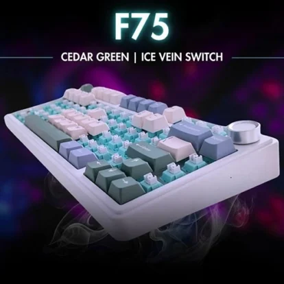 Angled mechanical keyboard with pastel green, mint, and beige keys, labeled 'f75 cedar green | ice vein switch' against a neon-lit background.