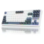 White full-size mechanical keyboard with rgb backlighting, angled view showing numeric keypad and colorful underglow