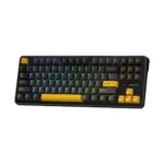 Compact mechanical keyboard with black frame and yellow accent keys on a dark body, with multi-colored backlighting