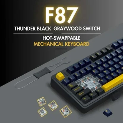 Exploded view of a hot-swappable mechanical keyboard with yellow keycaps and exposed switches and internals.