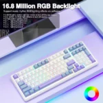 White mechanical keyboard with rainbow rgb backlighting on a pastel desk; large overlay text reads '16. 8 million rgb backlight'.