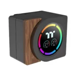 Smart thermostat with a circular color touchscreen showing temperature readouts, mounted on a wooden block